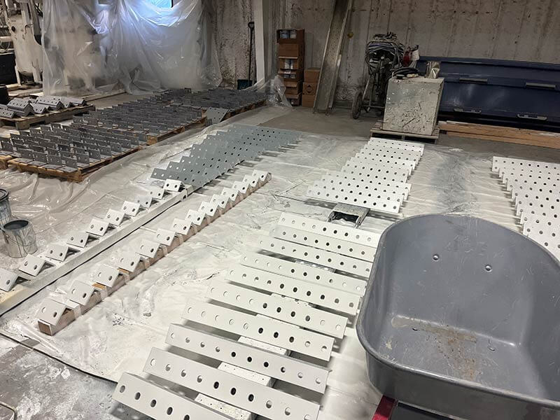 Brackets being painted by Mongan Painting