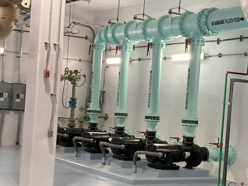 Pipes being painted by Mongan Painting