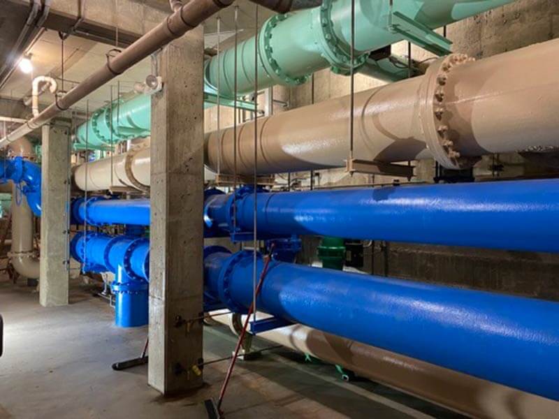 Pipes being painted by Mongan Painting